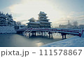 Matsumoto Castle in the morning sun and snow 111578867