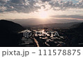 Drone shot of rice fields and Alps mountains at sunset 111578875