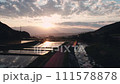 Drone shot of rice fields and Alps mountains at sunset 111578878