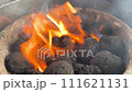 Bright Flames Igniting Charcoal on Grill. 111621131