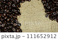 Coffee beans in burlap bag. Concept for international coffee culture. and business. Slow motion macro dolly tracking shot. selective focus. 4k 111652912