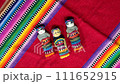 Mayan worry dolls on colorful indigenious handmade textiles.. Concept for international culture. Slow motion macro slow motion with rotaion. 4k 111652915