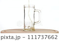 Beer is poured into a glass goblet. Slow motion 111737662