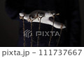 Manipulator hands in white gloves with ropes on fingers 111737667