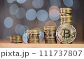 Stacked Bitcoins on the desk 111737807