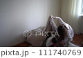 teenage girl builds a fortress out of pillows for her little brother 111740769
