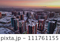 an aerial view of a city covered in snow seen from above at sunset 111761155