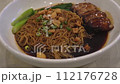 Close-up view of the bbq pork wanton noodle with crackling 112176728