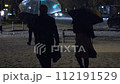 Snow falling in Tokyo at night and pedestrians walking on the snowy road at the intersection, Tokyo Station Marunouchi 112191529