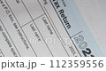 USA 1040 individual tax return form for 2023, close-up. High level pan shot. High quality 4k footage 112359556