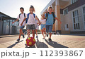 children near the school playing soccer. kids a school education kid dream concept. a group of children near the school playing ball. a group of lifestyle school children playing 112393867