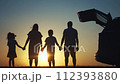 family traveling by car. family watching the sunset silhouette next to the car in the park. family holding hands play pinwheel. people in the park. family car camping resting lifestyle in nature 112393880