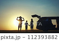 family traveling by car. family watching the sunset silhouette next to the car in the park. happy family kid dream concept. people in the park. family car camping resting lifestyle in nature 112393882