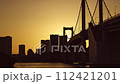 Timelapse from sunset to tonight of a suspension bridge and city buildings (Rainbow Bridge) 112421201