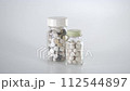 A bottle containing two tablets lined up② 112544897