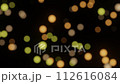 Defocused bokeh particles light on black background 4K loop 112616084