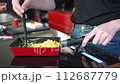 Japanese woman making scrambled eggs 4K slow motion 112687779