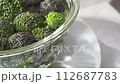 Broccoli rotating on rotating table close-up shot 4K slow motion 112687783