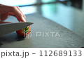 Japanese woman cutting strawberries with a knife 4K slow motion 112689133