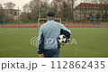 Old man paying sport game at the stadium. Healthy lifestyle. 112862435