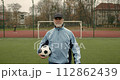 Old man paying sport game at the stadium. Healthy lifestyle. 112862439