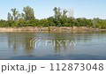 Missouri River flowing in early fall scenery as seen from Steamboat Trace Trail near Brownville, Nebraska 112873048