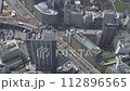 A view from the Sunshine 60 Observation Deck of cars passing on the highway between city buildings. 112896565