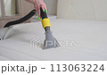 General cleaning of the house. Cleaning the mattress with a modern vacuum cleaner 113063224