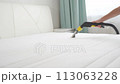 General cleaning of the house, dry cleaning of the mattress at home with a modern vacuum cleaner 113063228