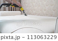 Professional way of cleaning upholstered furniture. Dry cleaning of the sofa 113063229