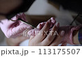 Shaping the nail with a file during a manicure 113175507