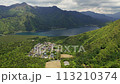 Aerial view of a spectacular volcanic lake surrounded by mountains and forest (Lake Saiko, Fujigoko, Japan) 113210374