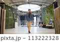 Handsome man walking at luxury shop and chooses tiles 113222328