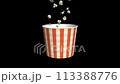 A video of butter popcorn being mass-produced and piled high into cups at a movie theater 113388776