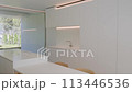 Kitchen with cabinetry, table, chairs, sink, and hardwood flooring 113446536