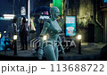 female robot walking along a street in a big city. humanoid AI robot crossing street. 3d animation. future automation job. 113688722