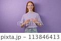 happy hardworking deaf red-haired girl expressing her positive feelings 113846413