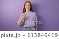 cheerful red-haired deaf girl says I am OK, and You 113846419