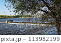 The flow of water from the outlet of an artificial dam 113982199