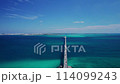 Drone shot of the Irabu Bridge connecting Miyako Island and Irabu Island and the blue sea⑧ 114099243