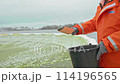 Daily Rituals at the Fish Farm: Feeding Time with Mixed Pellets 114196565