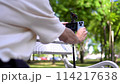 a young man film video of himself on the phone and displays the video on the monitor screen 114217638