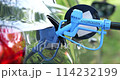 Close up of fuel cell car with connected hydrogen fueling nozzle 114232199