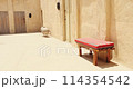 old Arab bench. Wooden bench. Arabic benches. Ancient Middle East. Sofa in Arabic style in house. Resting place in an Arab house. Moroccan style. Traditional arabic bench in the streets of old Dubai 114354542
