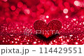 A red heart on a glitter bokeh background. 114429551