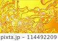 Super Slow Motion Shot of Golden Oil Flowing in Water at 1000fps. 114492209