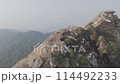 Finding Peace as a Man Sits on the Himalayan Peak 114492233