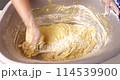 Confectioner kneads dough for baking dough 114539900