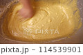 Confectioner kneads dough for baking dough 114539901
