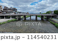 Drone shot of the Kamo River flowing through the center of Kyoto City 114540231